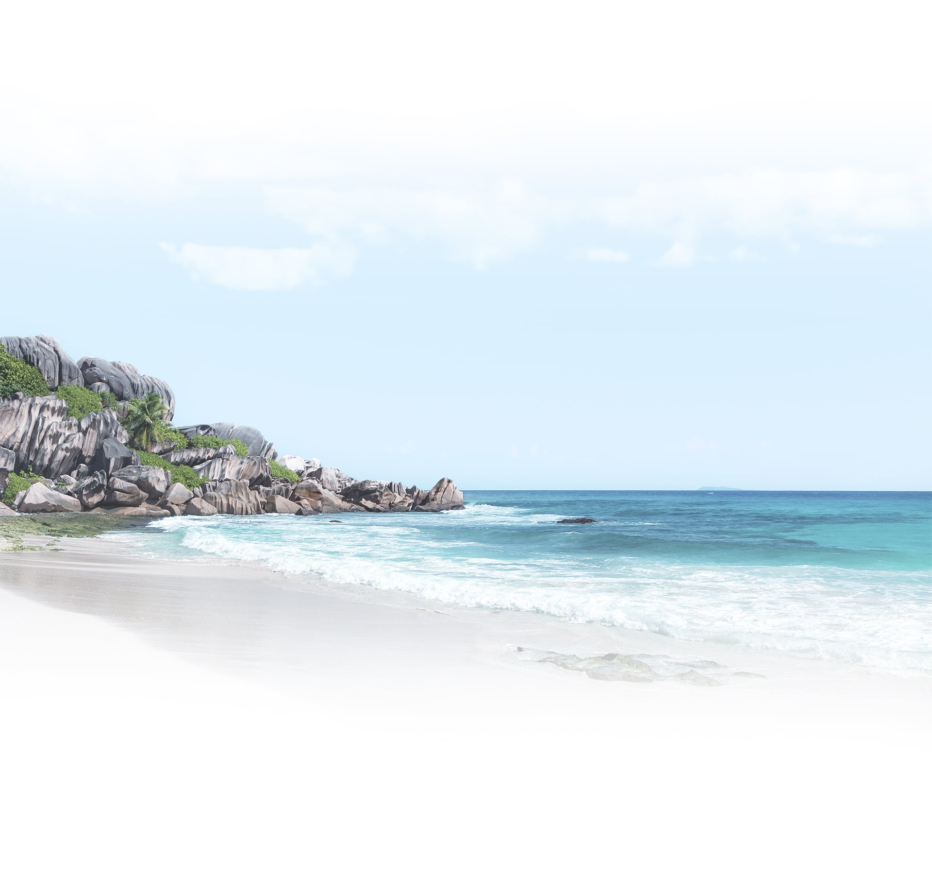 Tropical coastline with granite cliffs and turquoise water